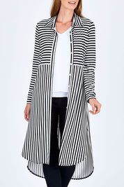 Model Riina wearing size 10 of The Midi Jersey Shirt Dress in colour BlkWhite (Black), from the front, cropped image