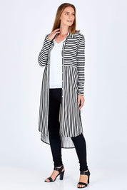 Model Riina wearing size 10 of The Midi Jersey Shirt Dress in colour BlkWhite (Black), from the front, showing the whole outfit