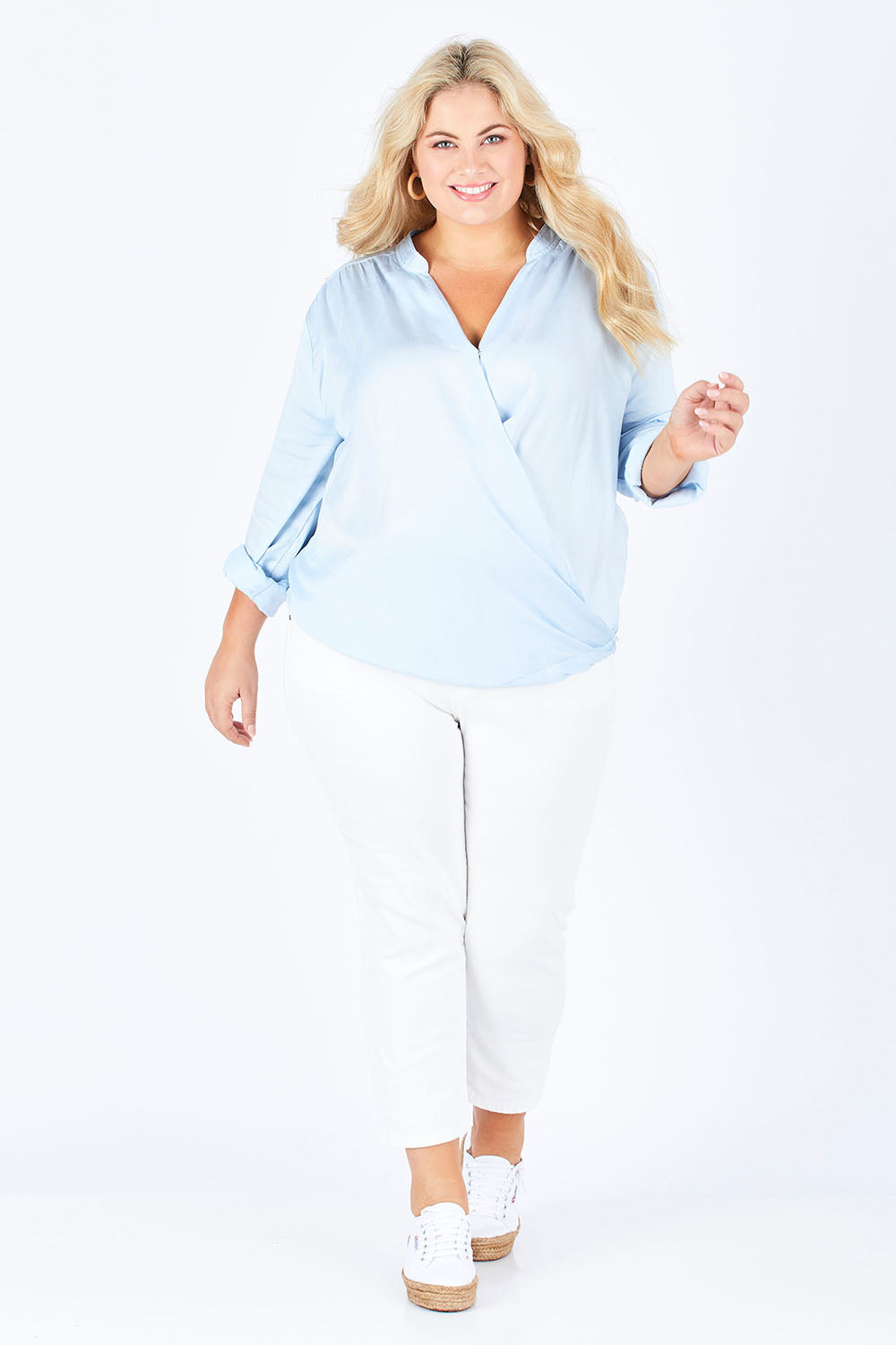 Model Sophie wearing size 18 of The Daily Cross Over Top in colour SkyBlue (Blue), from the front, showing the whole outfit