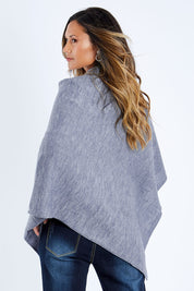 Model Kimberley wearing size S of The Perfect Poncho in colour Bluemarle (Blue), from the back