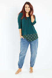 Model Laura wearing size 14 of The Pull On Jogger Jean in colour Denim (Blue), from the front, showing the whole outfit