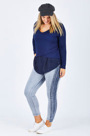 Model Jess wearing size 14 of The Step Hem Jean in colour Blue (Blue), from the front, showing the whole outfit