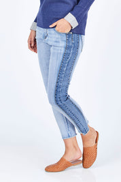 Model Riina wearing size 10 of The Step Hem Jean in colour Blue (Blue), from the front, cropped image