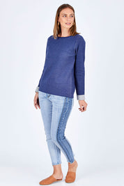 Model Riina wearing size 10 of The Step Hem Jean in colour Blue (Blue), from the front, showing the whole outfit
