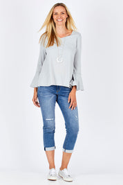 Model Anna wearing size 10 of The Bell Sleeve Top in colour Grey (Grey), from the front, showing the whole outfit