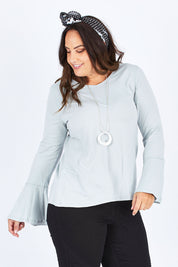 Model Stacey wearing size 12 of The Bell Sleeve Top in colour Grey (Grey), from the front, cropped image