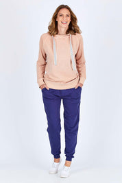 Model Riina wearing size 10 of The Tie Detail Hoody in colour Pink (Black), from the front, showing the whole outfit