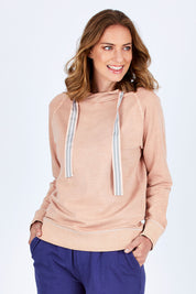 Model Riina wearing size 16 of The Tie Detail Hoody in colour Pink (Black), from the front, cropped image