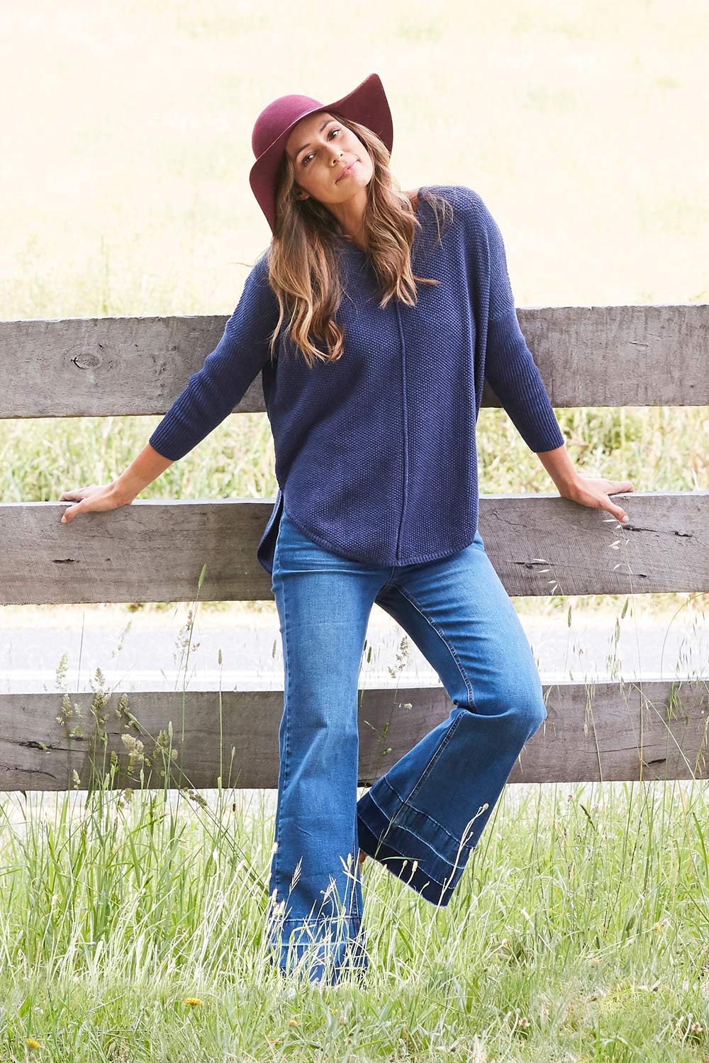 Model Amanda wearing size 10 of The Bootcut Jean in colour Denim (Blue), from the front, showing the whole outfit