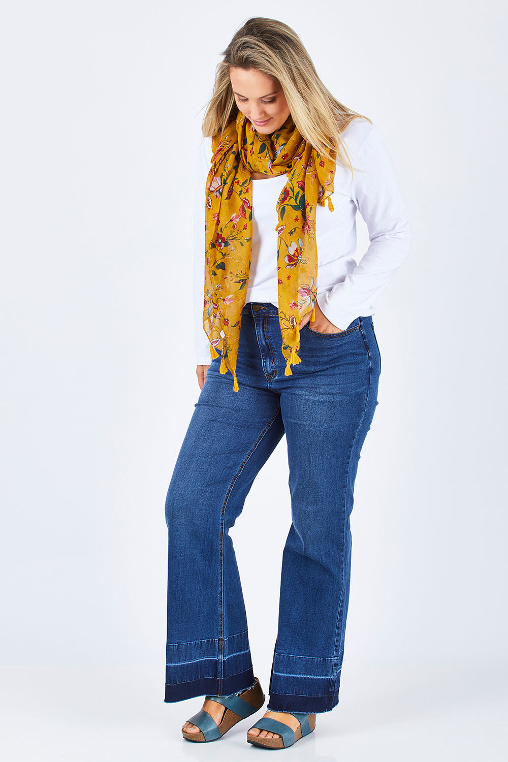 Model Jess wearing size 14 of The Bootcut Jean in colour Denim (Blue), from the front, showing the whole outfit