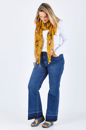 Model Jess wearing size 14 of The Bootcut Jean in colour Denim (Blue), from the front, showing the whole outfit