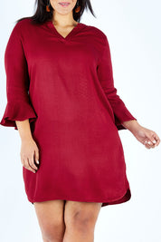 Model Lauren wearing size 18 of The Flute Sleeve Dress in colour Cherry (Red), from the front, cropped image