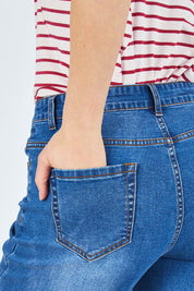 Model Chelsea wearing size 10 of The Wide Leg Jean in colour Denim (Blue), from the front, cropped image