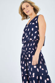 Model Chelsea wearing size 10 of The Overlay Maxi Dress in colour Spotprint (Blue), from the front, cropped image
