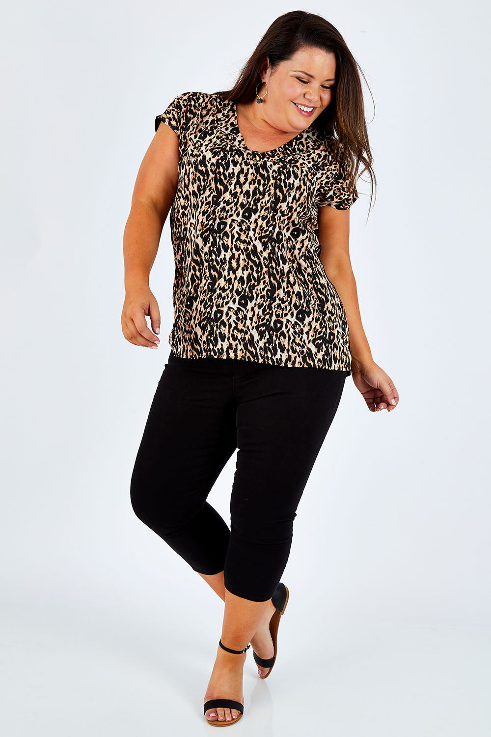 Model Stacey wearing size 16 of The Cropped Skinny Pull On Jean in colour Black (Black), from the front, showing the whole outfit