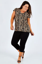 Model Stacey wearing size 16 of The Cropped Skinny Pull On Jean in colour Black (Black), from the front, showing the whole outfit