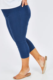 Model Stacey wearing size 16 of The Cropped Skinny Pull On Jean in colour Blue (Blue), from the front, cropped image