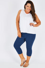 Model Stacey wearing size 16 of The Cropped Skinny Pull On Jean in colour Blue (Blue), from the front, showing the whole outfit