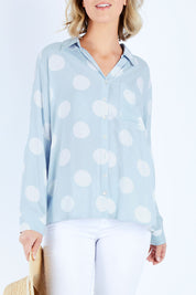 Model Chelsea wearing size 10 of The Relax Spot Shirt in colour Chambspot (Blue), from the front, cropped image