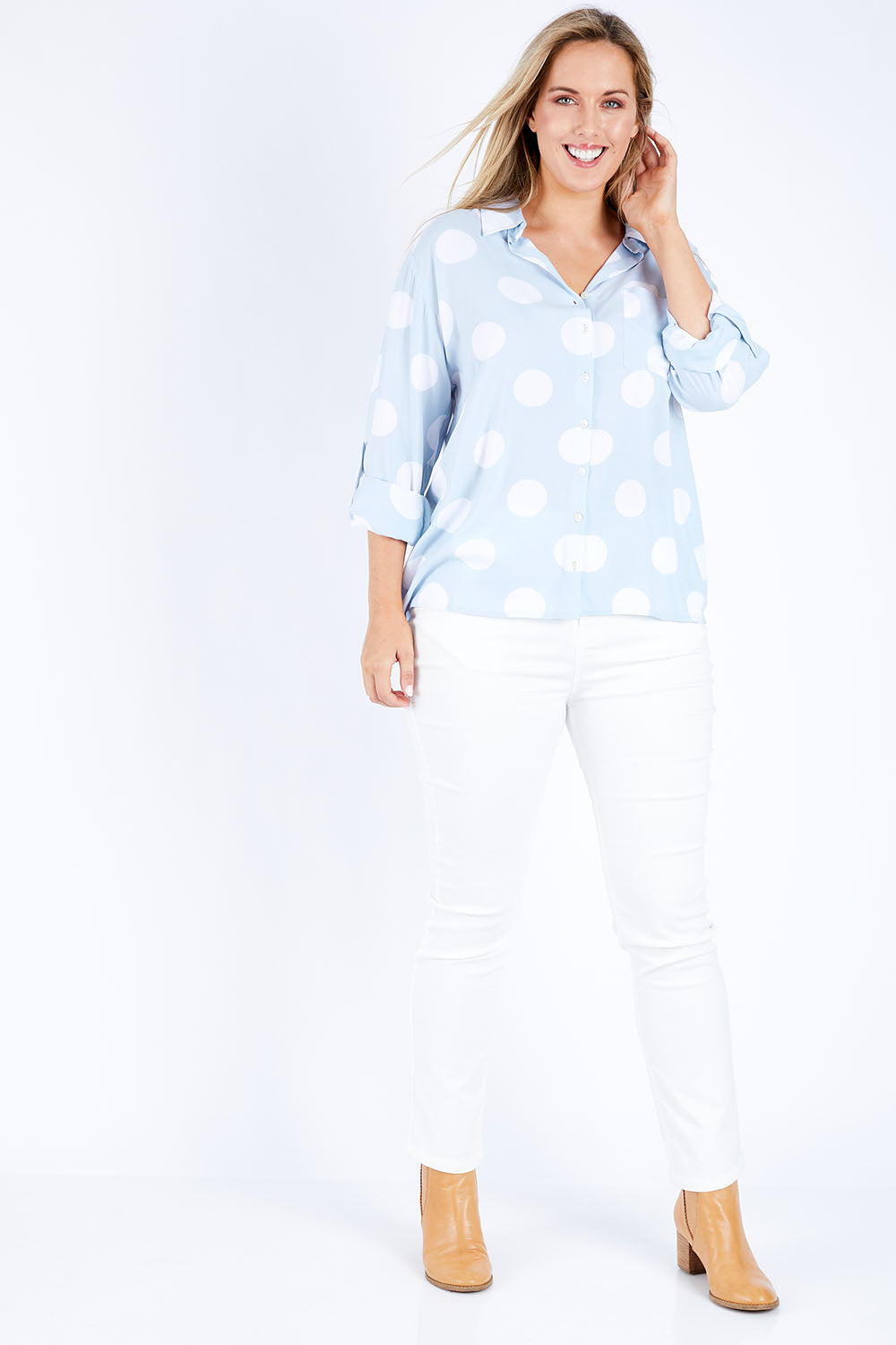 Model Jess wearing size 14 of The Relax Spot Shirt in colour Chambspot (Blue), from the front, showing the whole outfit