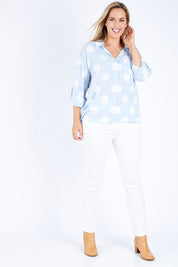 Model Jess wearing size 14 of The Relax Spot Shirt in colour Chambspot (Blue), from the front, showing the whole outfit