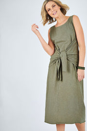 Model Chelsea wearing size 10 of The Tie Waist Tank Dress in colour Khaki (Green), from the front, cropped image