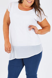 Model Stacey wearing size 16 of The Chiffon Trim Top in colour White (White), from the front, cropped image