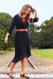 Model Jess wearing size 14 of The Chiffon Trim Dress in colour Black (Black), from the front, showing the whole outfit