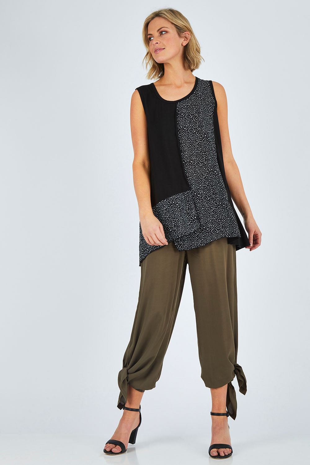 Model Chelsea wearing size 10 of The Tie Split Pull On Pant in colour Khaki (Green), from the front, showing the whole outfit