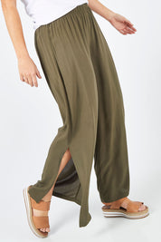 Model Laura wearing size 14 of The Tie Split Pull On Pant in colour Khaki (Green), from the front, cropped image