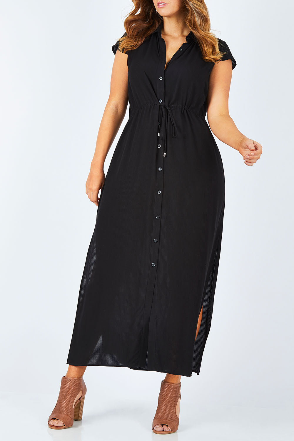 Model Laura wearing size 14 of The Button Up Maxi in colour Black (Black), from the front, cropped image