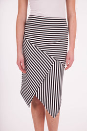 Model Anna wearing size 10 of The Contrast Striped Skirt in colour BlackWhite (Black), from the front, cropped image