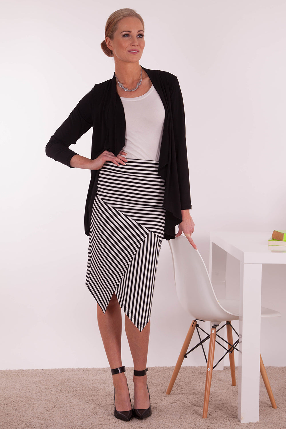 A model wearing The Contrast Striped Skirt in colour BlackWhite (Black), from the front, showing the whole outfit