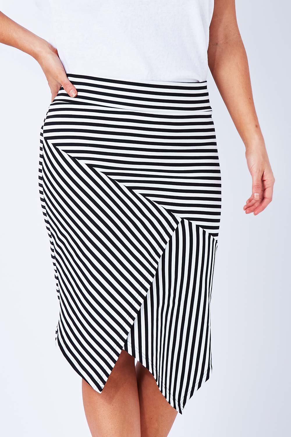 Model Laura wearing size 12 of The Contrast Striped Skirt in colour BlackWhite (Black), from the front, cropped image
