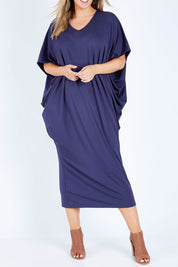 Model Jess wearing size 14 of The Midi Bamboo Dress in colour Navy (Blue), from the front, cropped image