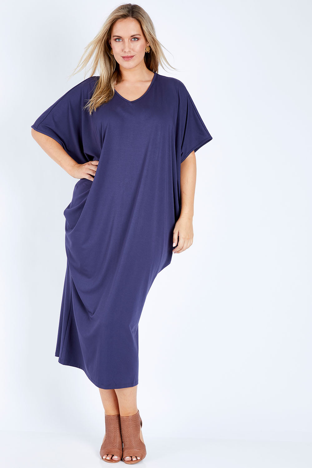 Model Jess wearing size 14 of The Midi Bamboo Dress in colour Navy (Blue), from the front, showing the whole outfit