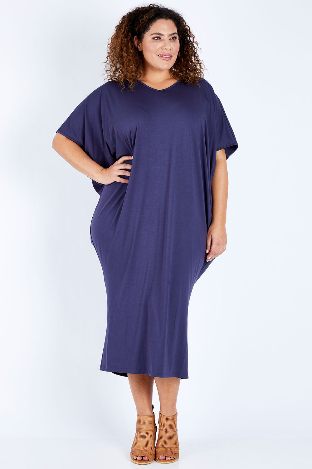 Model Jess wearing size 16 of The Midi Bamboo Dress in colour Navy (Blue), from the front, showing the whole outfit