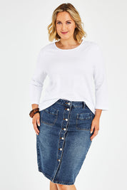 Model Jess wearing size 14 of The Midi Button Up Skirt in colour Darkdenim (Blue), from the front, cropped image