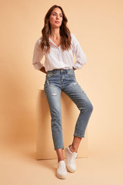 Model Madeline wearing size 10 of The Distressed Boyfriend Slim Leg Jean in colour Blue (Blue), from the front, showing the whole outfit