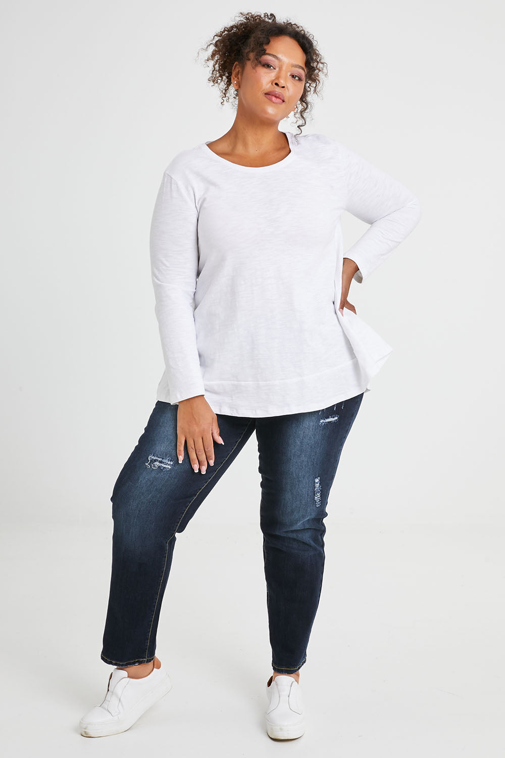 Model Alexis wearing size 16 of The Distressed Boyfriend Jean in colour Darkdenim (Blue), from the front, showing the whole outfit