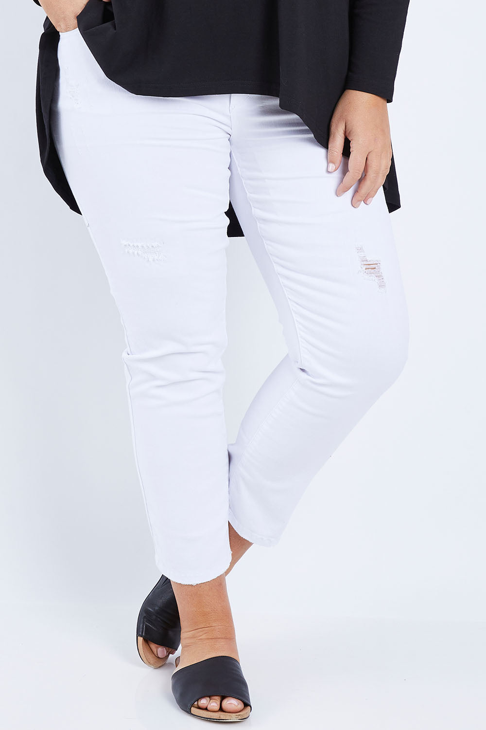 Model Fiona wearing size 16 of The Distressed Boyfriend Jean in colour White (White), from the front, cropped image