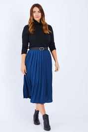 Model Laura wearing size 14 of The Pleated Skirt in colour Navy (Blue), from the front, showing the whole outfit