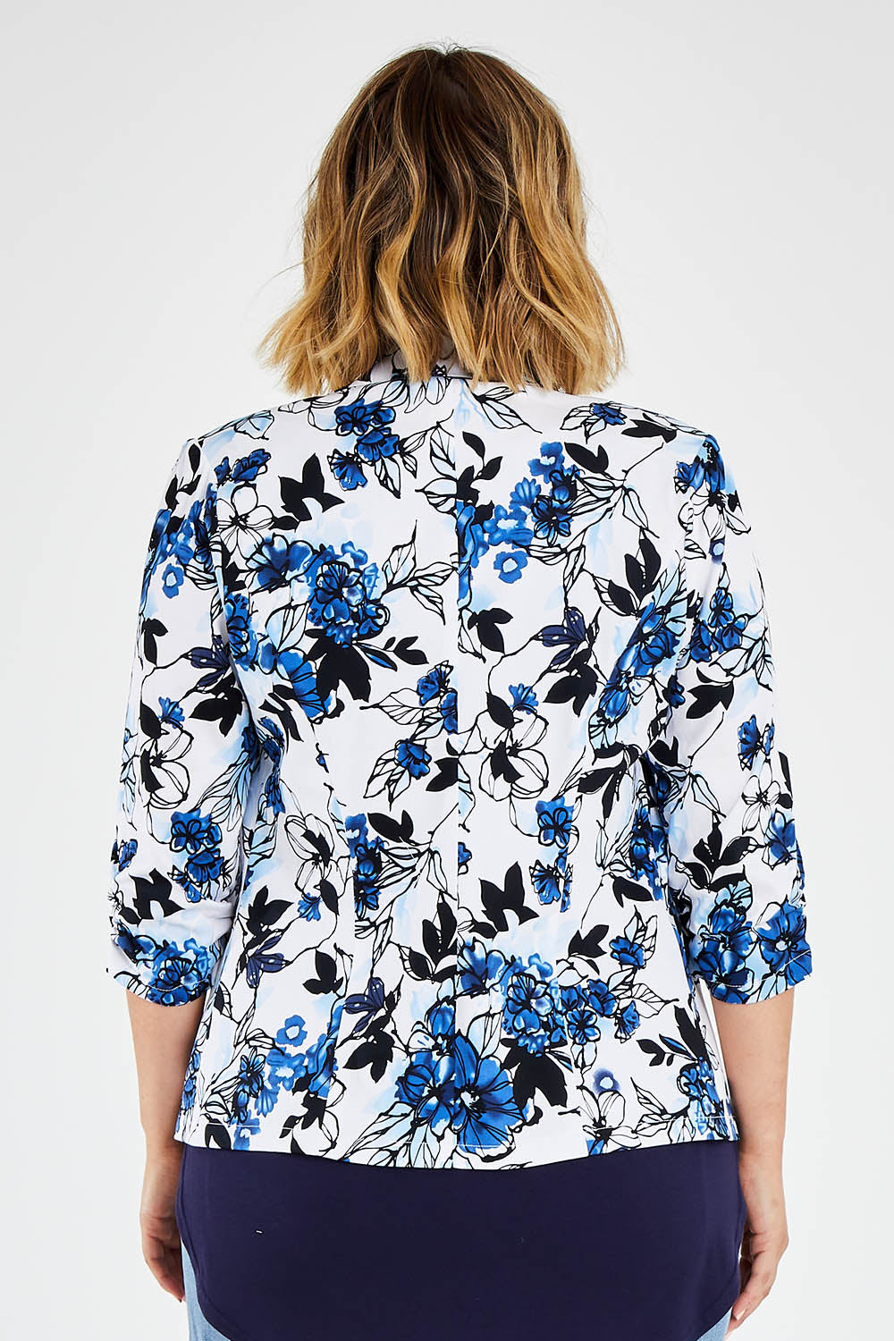 Model Jess wearing size 14 of The Everyday Printed Blazer in colour Bluefloral (Blue), from the back