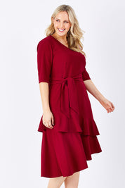 Model Jess wearing size 14 of The Layer Midi Dress in colour DeepRed (Red), from the front, cropped image
