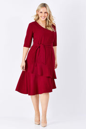 Model Jess wearing size 14 of The Layer Midi Dress in colour DeepRed (Red), from the front, showing the whole outfit