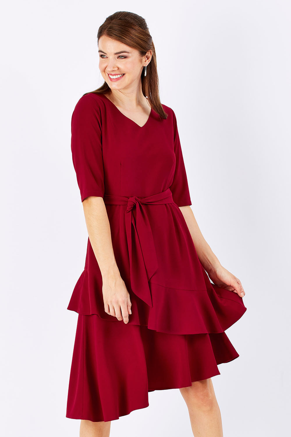 Model Rebecca wearing size 10 of The Layer Midi Dress in colour DeepRed (Red), from the front, cropped image