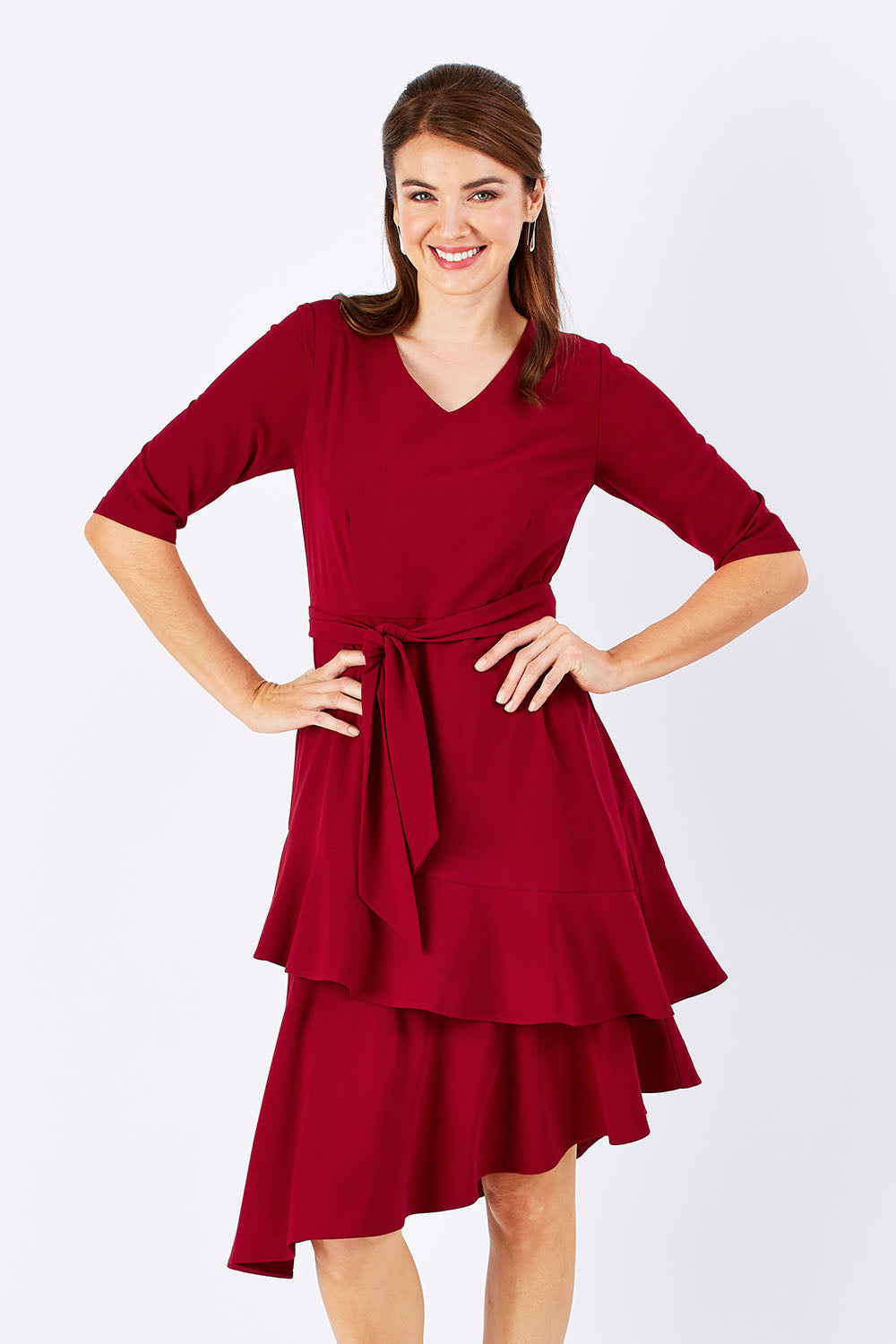 Model Rebecca wearing size 10 of The Layer Midi Dress in colour DeepRed (Red), from the front, cropped image