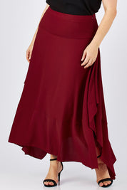 Model Ljubenka wearing size 18 of The Flowy Skirt in colour Apple (Red), from the front, cropped image