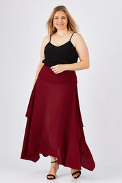 Model Ljubenka wearing size 18 of The Flowy Skirt in colour Apple (Red), from the front, showing the whole outfit