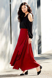 Model Miranda wearing size 8 of The Flowy Skirt in colour Apple (Red), from the front, showing the whole outfit